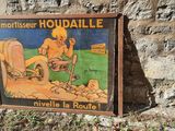 a sign on the side of a building that says houdaille