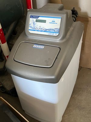 une photo d'une machine à laver dans un garage