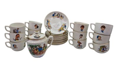 many cups and saucers with pictures of children on them