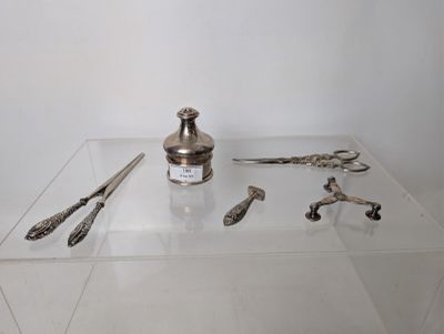 a glass display case with silver objects on it