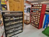 a lot of boxes and bins on the floor