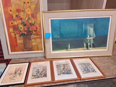 three framed pictures on a table with a vase of flowers