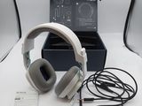 a pair of headphones sitting on a table next to a box