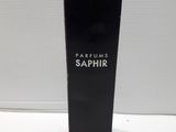 a black box of perfume sitting on top of a white table