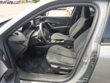 the interior of a car with the door open and the passenger seat down