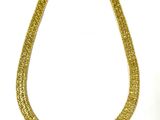 a close up of a gold necklace on a white background