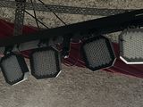 three lights that are hanging from the ceiling of a building