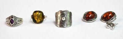 four different rings and a ring with a stone on it