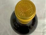 a bottle of wine that is sitting on a table