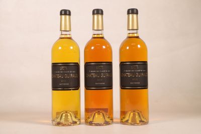 three bottles of wine sitting next to each other on a table