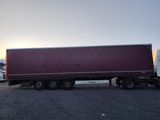a semi truck that is parked in a parking lot