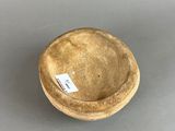 an image of a small bowl with a tag on it