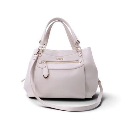 sac à main en cuir blanc sur fond blanc, muni d'une bandoulière