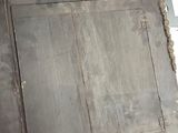 an old wooden door that is sitting in a room