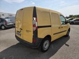 a yellow van that is parked in a parking lot