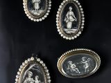 a group of three oval cameos of women and children