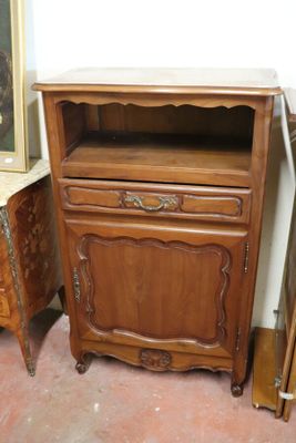 a small wooden cabinet with a drawer on top of it