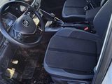 a picture of the inside of a car with the door open