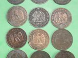 six different types of coins on a green surface
