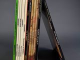 books stacked on top of each other on a gray surface