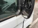 an image of a car with a broken mirror on the side of the road