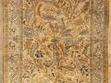 an antique persian rug with a floral design on a beige ground