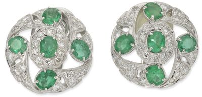 a pair of emerald and diamond earrings