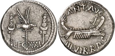 a silver coin with an image of a bird on it