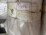 many rolls of plastic wrapped up in a warehouse