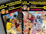 two comics are sitting on a table next to each other