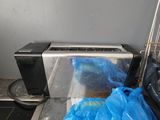 a blue bag sitting on top of a conveyor belt