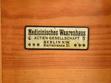 a wooden cabinet with a sign on the door