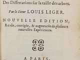 an old book with writing on it sitting on a table