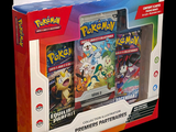 a box of pokemon cards on display on a black background