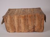 an old wooden box with a handle on it