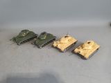 several toy tanks are lined up in a row on the floor