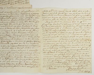 deux pages d'une lettre écrite en cursive sur un support blanc