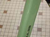 a close up of a bike with a green frame