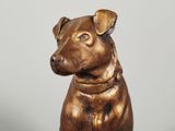 a statue of a dog with a collar on it ' s neck