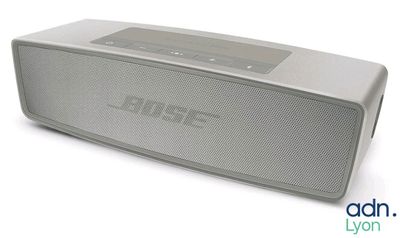 a close up of a speaker on a white surface