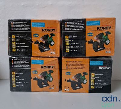four boxes of rondy power tools sitting on a table