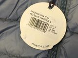 the label on the back of a puffy jacket is attached to a zipper