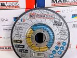 a picture of a metal grinding disc on top of a stack of boxes
