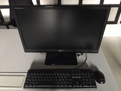a desktop computer sitting on a desk with a keyboard and mouse