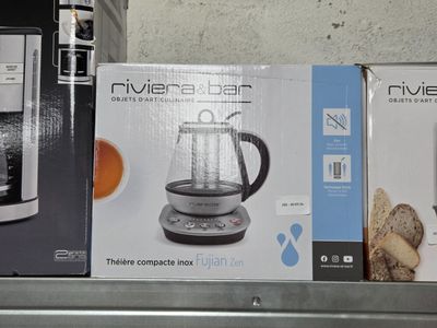 a box of a coffee maker sitting on a shelf