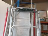 a ladder with a sign on it in a garage