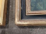 two framed pictures on the wall next to each other