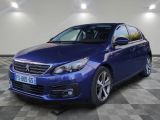 the blue car is parked in a room with a checkered floor