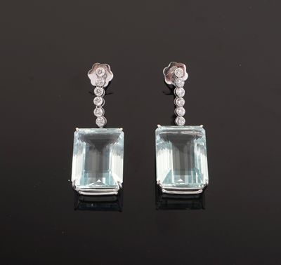 a pair of aquamarinee and diamond earrings