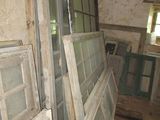 many old windows in a run down room